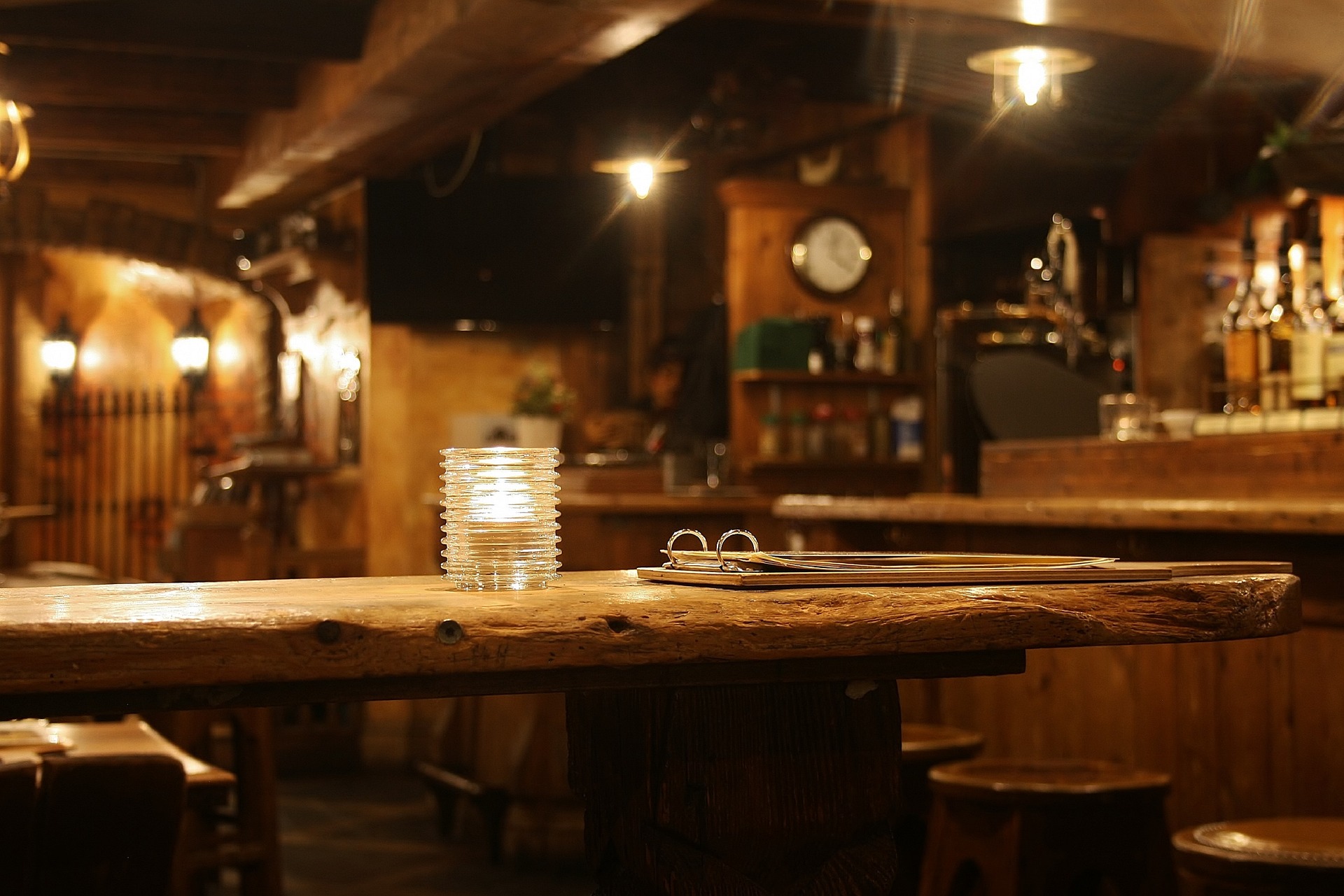 A candle-lit table in an Irish pub.